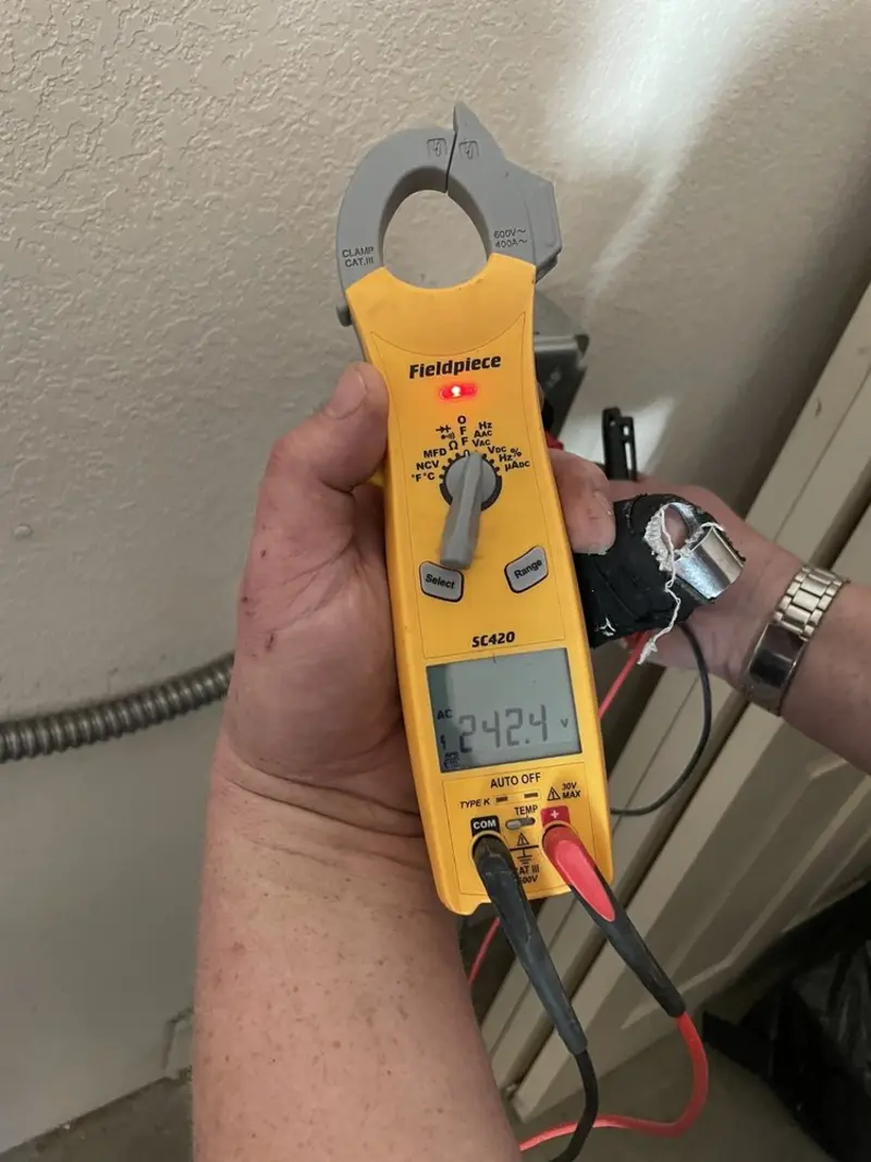 Voltage testing with clamp meter during Electrical Installation Services in Jacksonville